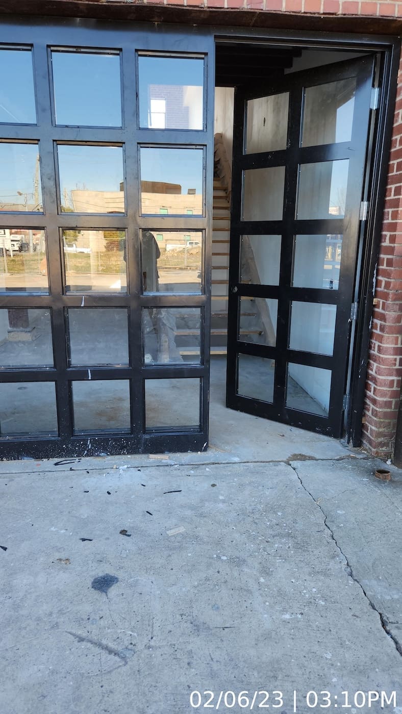 Door/window units installed. Glazing in progress.