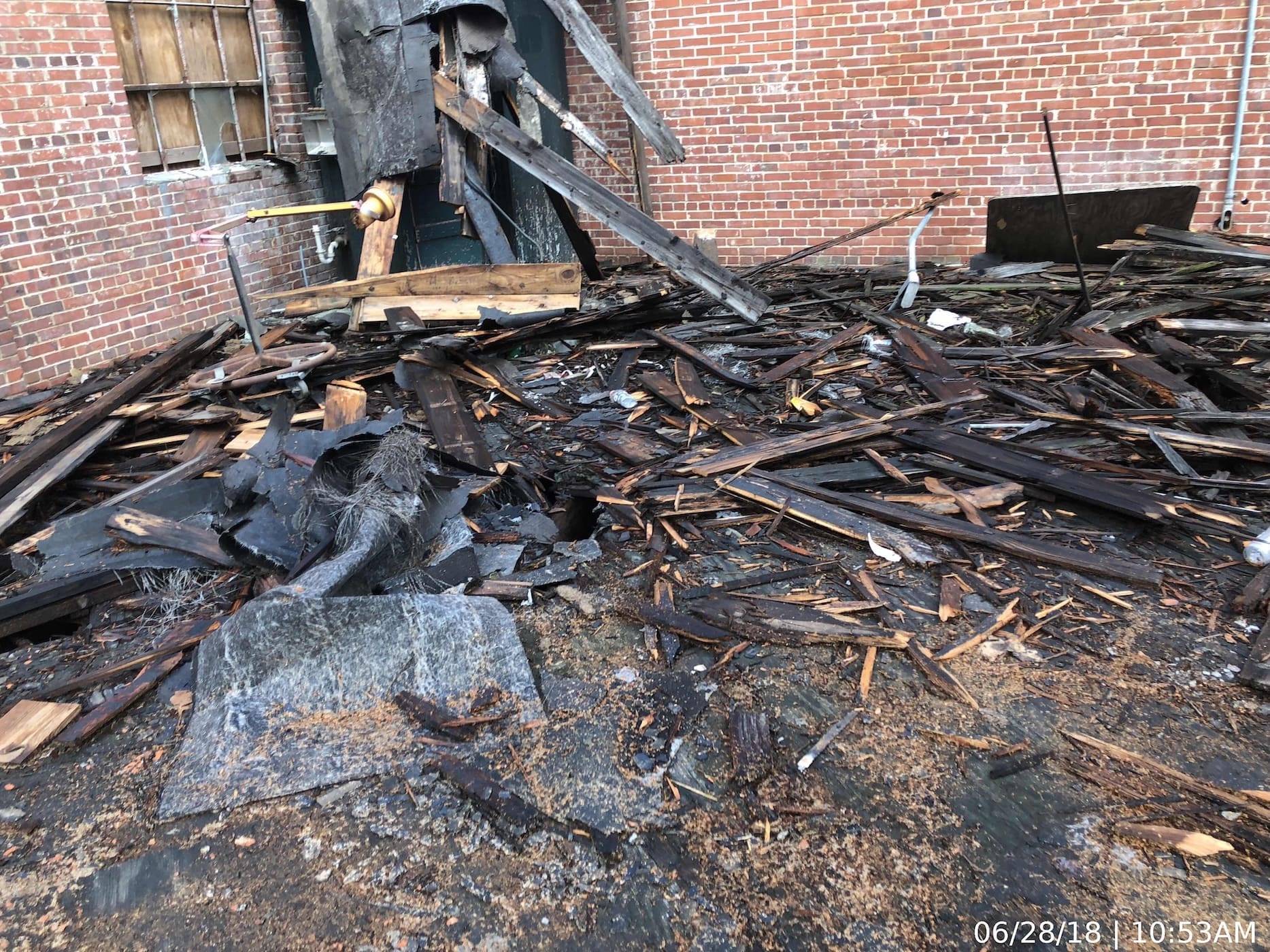 Demolition debris from section of roof framing that had completely failed.