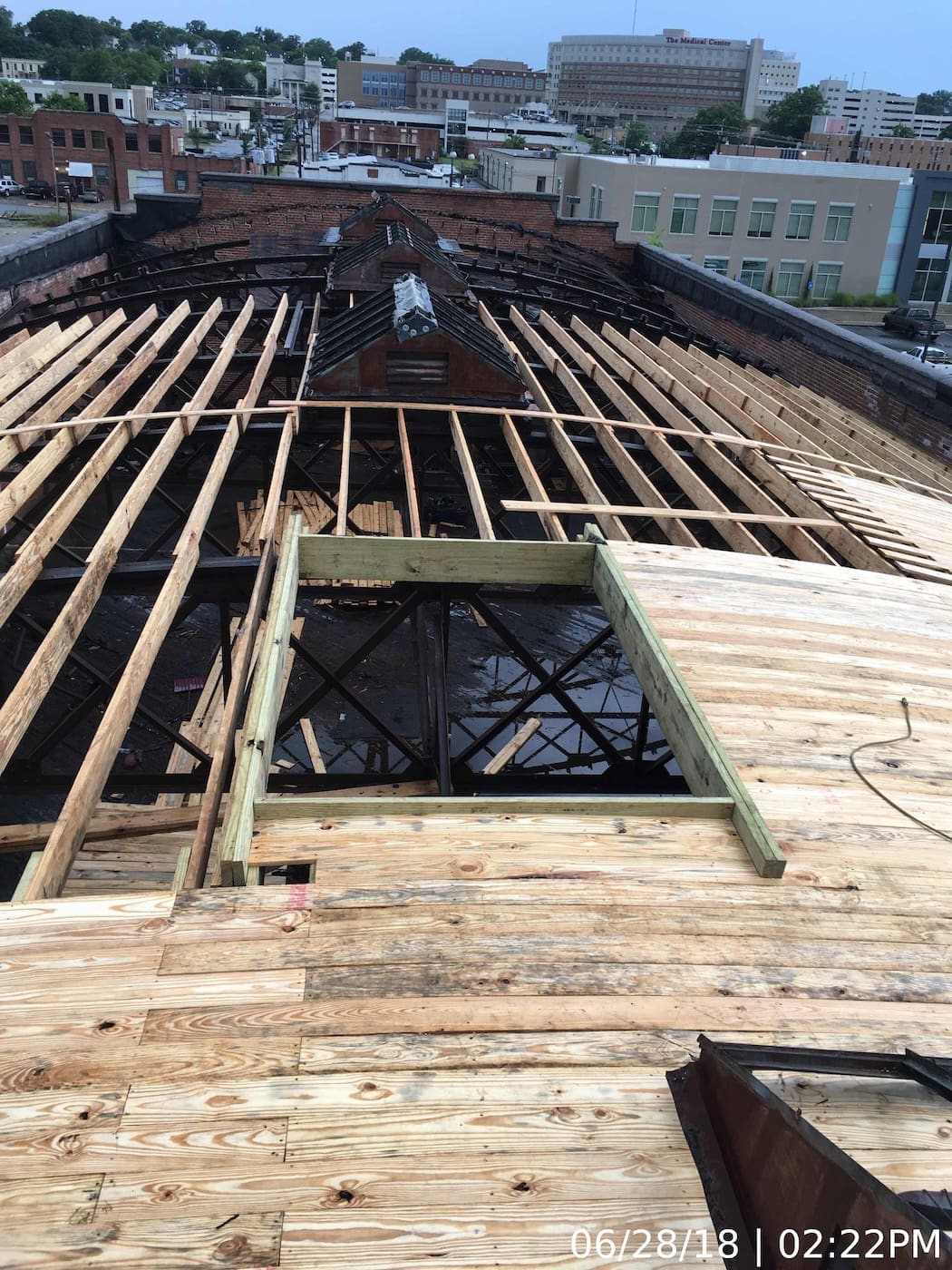 Removal and replacement of deteriorated roof framing and decking. Material used to match existing per Historic Preservation requirements.