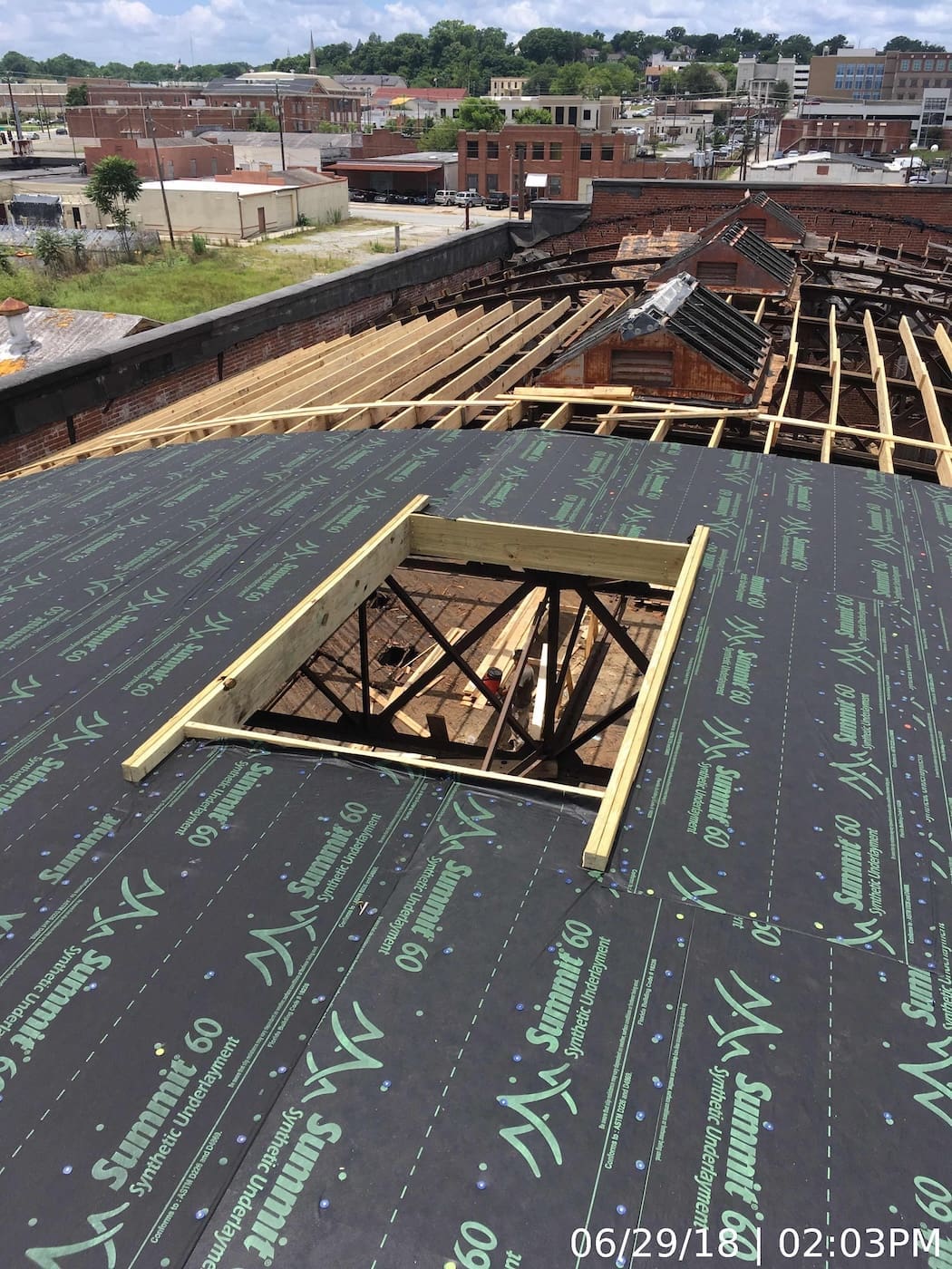 Partial “dry-in” of a portion of the roof system.