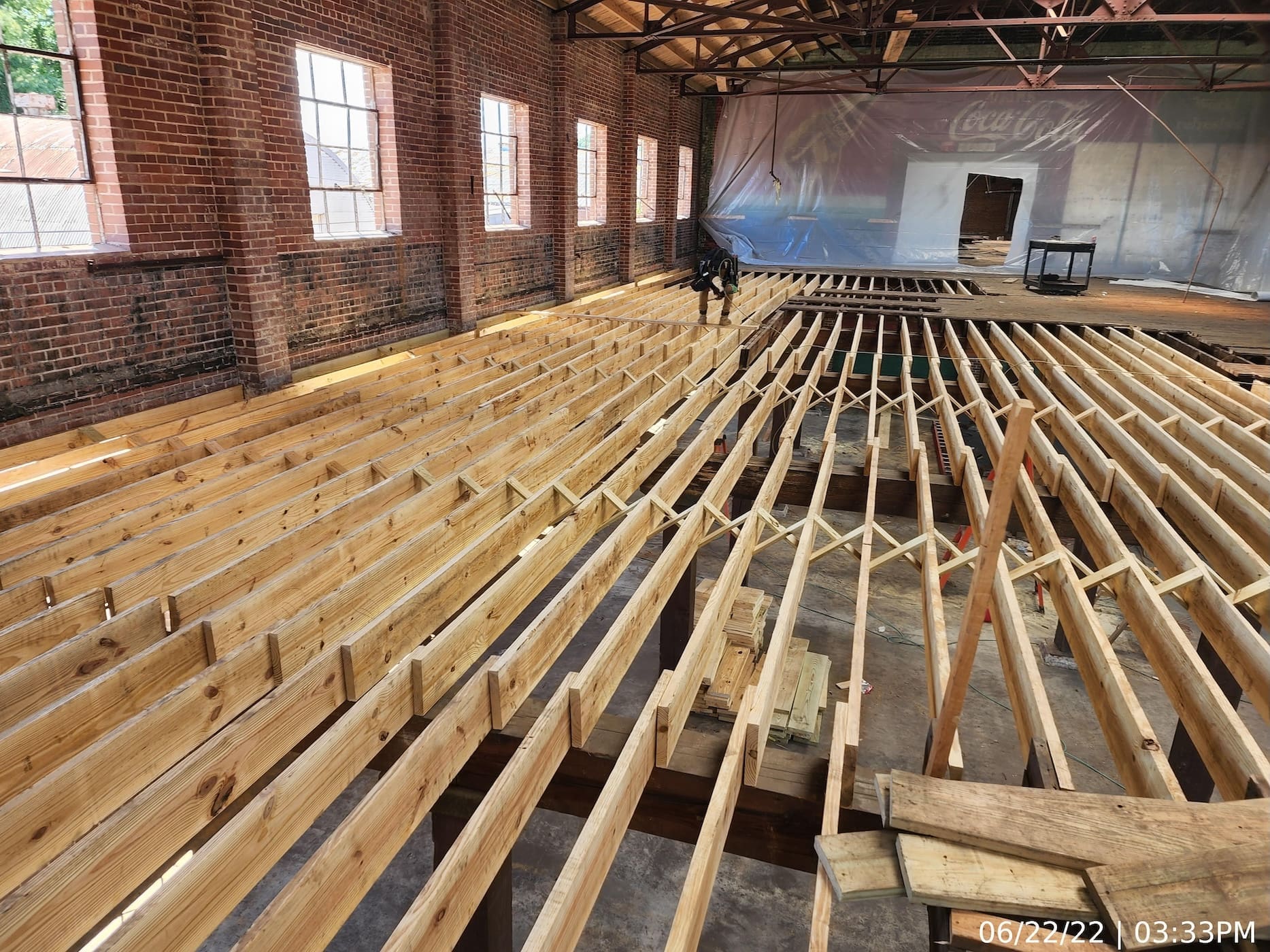 New floor framing for upper-level construction. Framing material and layout matches existing that was removed.