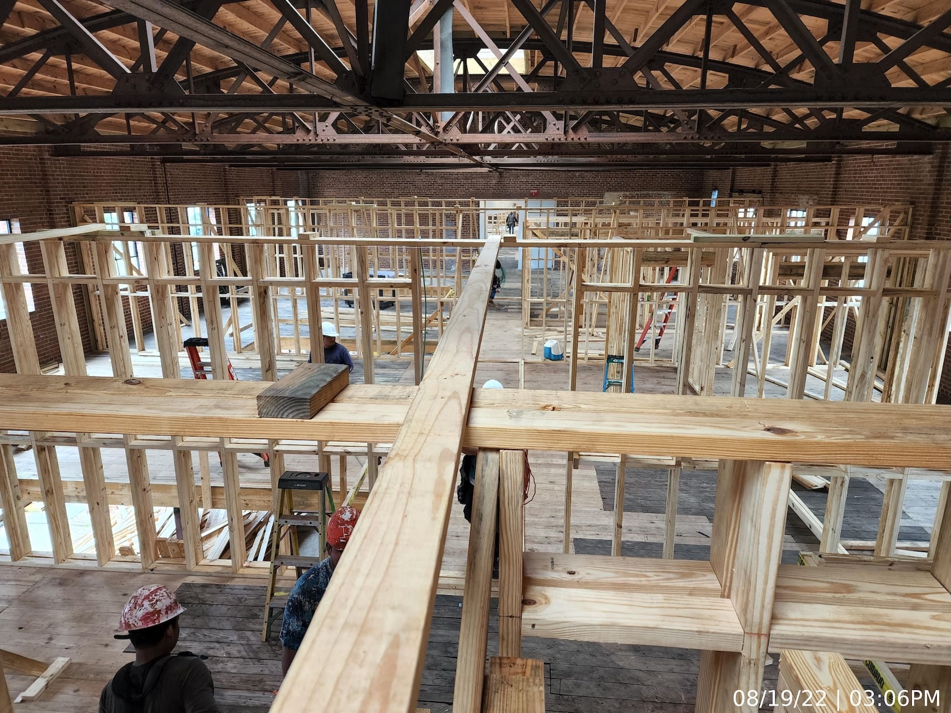 Upper level interior framing continues.