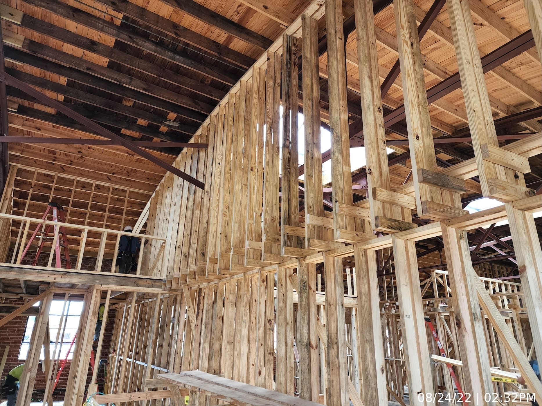 Upper level interior framing of fire-rated demising walls.