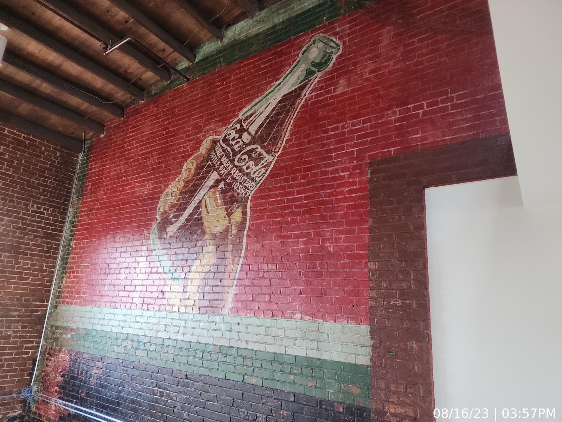 Portion of existing “Coca Cola” graphic protected throughout construction and retained in one of the two-story units.