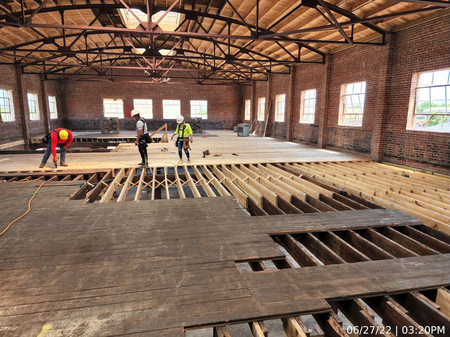 Roof framing and decking complete. Floor framing installed. Beginning installation of new subfloor. Material type, orientation, and installation to match existing due to Historic Preservation requirements.